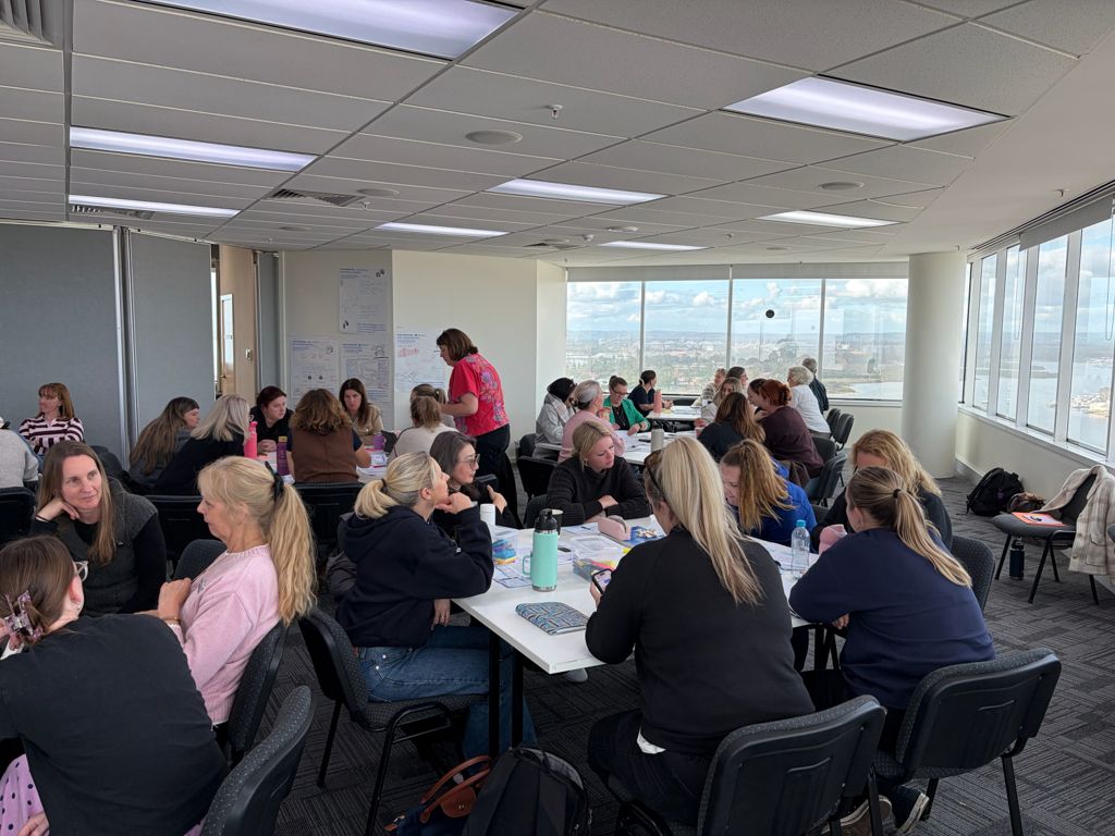 Educators in group discussion at a Cultures of Excellence workshop
