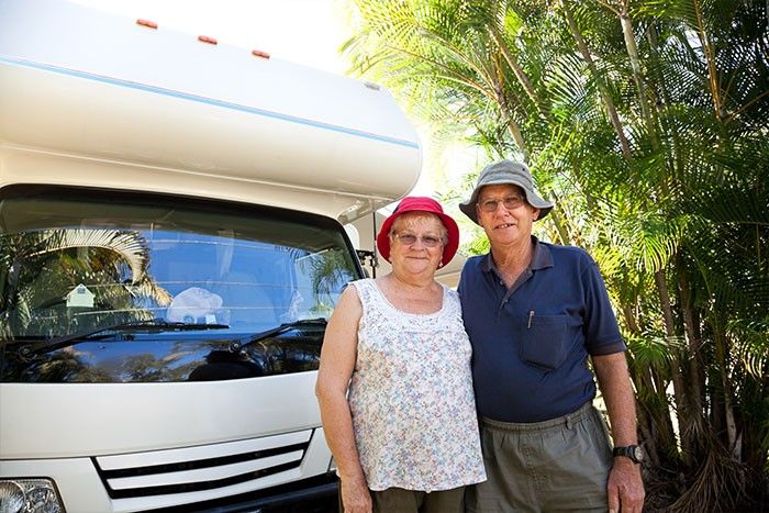 A couple with their motorhome, from Gilkison Group's own client photography